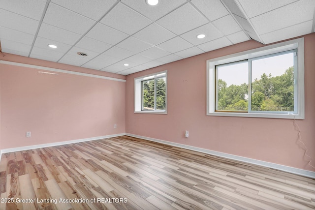 345 Linn Rd, Williamston, MI 48895 - empty room featuring light wood-style flooring, a drop ceiling, and recessed lighting