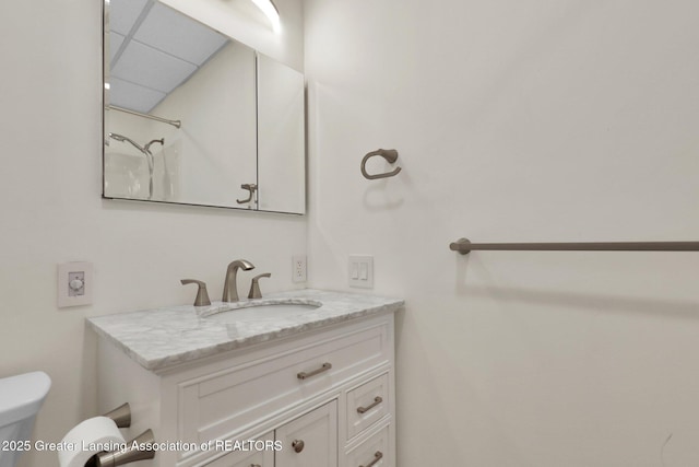 345 Linn Rd, Williamston, MI 48895 - bathroom featuring vanity and a drop ceiling