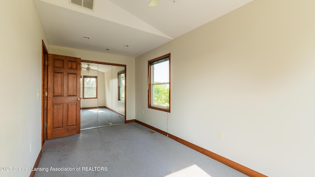 9271 W Burt Rd, Saint Charles, MI 48655 - empty room featuring baseboards, ceiling fan, lofted ceiling, and finished concrete flooring