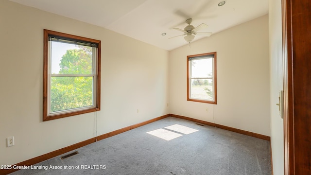 9271 W Burt Rd, Saint Charles, MI 48655 - carpeted empty room featuring healthy amount of natural light, lofted ceiling, baseboards, and a ceiling fan