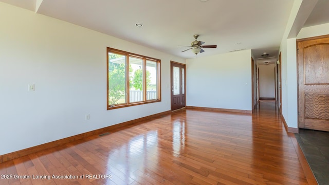 9271 W Burt Rd, Saint Charles, MI 48655 - unfurnished room featuring baseboards, wood-type flooring, and ceiling fan