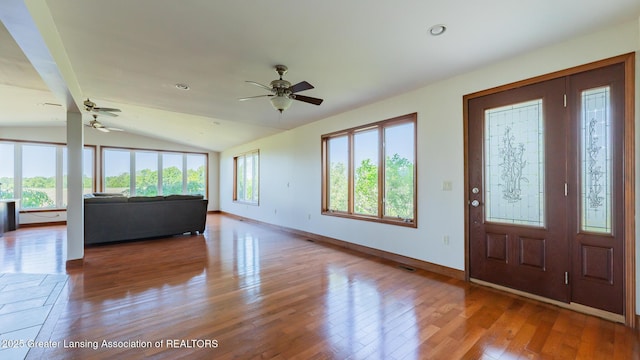 9271 W Burt Rd, Saint Charles, MI 48655 - foyer featuring ceiling fan, wood finished floors, vaulted ceiling, and baseboards