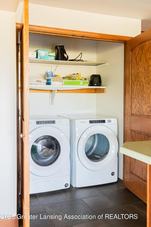 9271 W Burt Rd, Saint Charles, MI 48655 - washroom featuring washing machine and clothes dryer and dark tile patterned floors