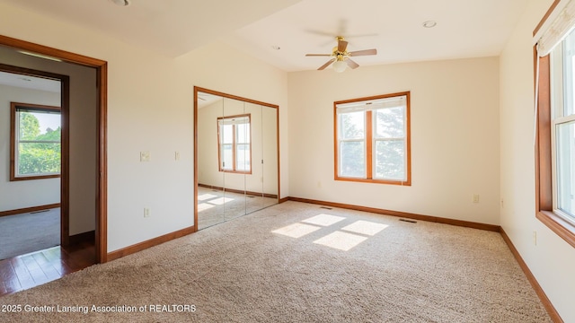 9271 W Burt Rd, Saint Charles, MI 48655 - carpeted spare room featuring healthy amount of natural light, baseboards, and a ceiling fan