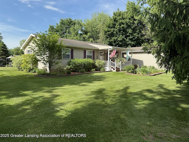 10470 Barnes Hwy, Eaton Rapids, MI 48827 - view of front of home featuring a front yard and a porch