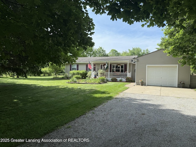 10470 Barnes Hwy, Eaton Rapids, MI 48827 - ranch-style house with a porch, a garage, driveway, and a front lawn