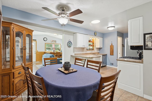 10470 Barnes Hwy, Eaton Rapids, MI 48827 - dining room with ceiling fan, light tile patterned floors, and a textured ceiling