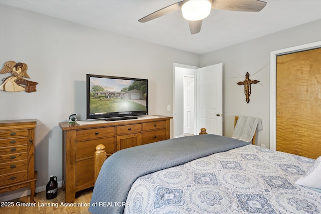 10470 Barnes Hwy, Eaton Rapids, MI 48827 - bedroom with light wood-style flooring, ceiling fan, and baseboards