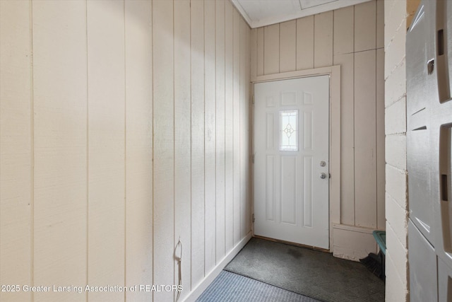 10470 Barnes Hwy, Eaton Rapids, MI 48827 - entryway with carpet flooring and wood walls