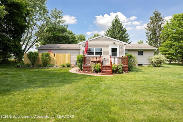 10470 Barnes Hwy, Eaton Rapids, MI 48827 - back of house with a deck and a lawn