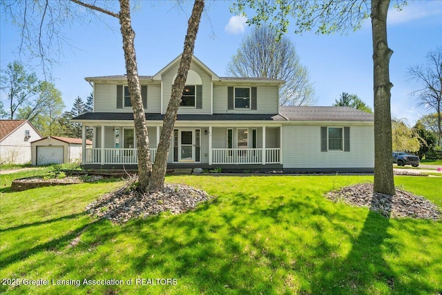 816 Creyts Rd, Dimondale, MI 48821 - view of front of house featuring a porch, a garage, a front lawn, and an outdoor structure