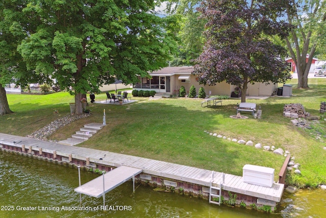 4951 Shore Ln, Perrinton, MI 48871 - back of property featuring a water view and a yard