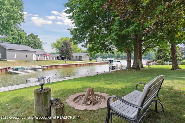 4951 Shore Ln, Perrinton, MI 48871 - view of grassy yard featuring a water view and a dock