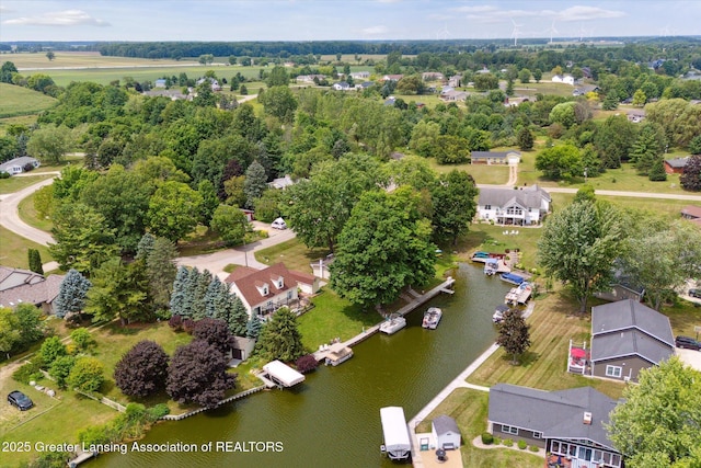 4951 Shore Ln, Perrinton, MI 48871 - aerial perspective of suburban area featuring a large body of water and a tree filled landscape