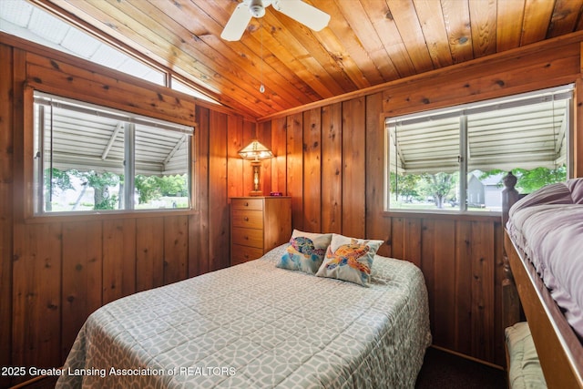 4951 Shore Ln, Perrinton, MI 48871 - bedroom featuring multiple windows, wooden walls, wooden ceiling, and a ceiling fan