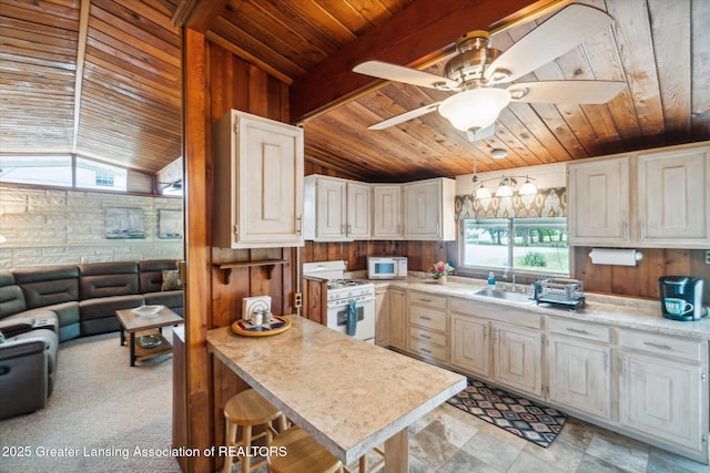 4951 Shore Ln, Perrinton, MI 48871 - kitchen featuring white appliances, wooden ceiling, vaulted ceiling, wood walls, and light countertops