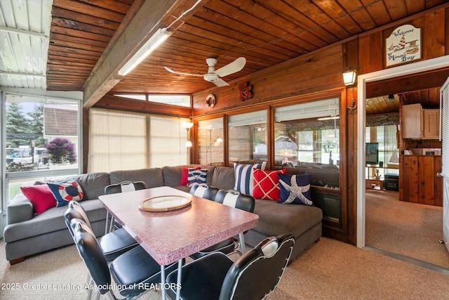 4951 Shore Ln, Perrinton, MI 48871 - dining area featuring carpet, wooden ceiling, ceiling fan, and wooden walls