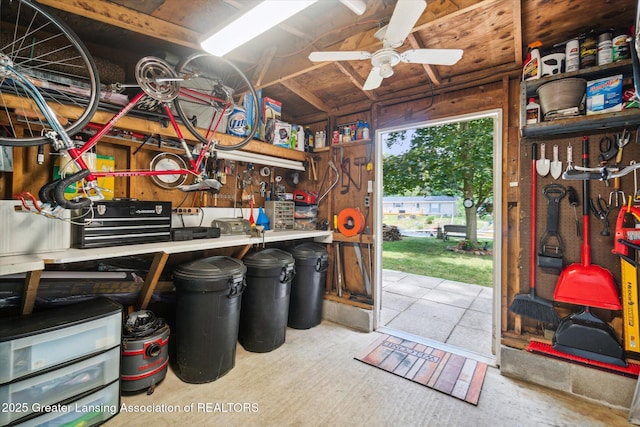 4951 Shore Ln, Perrinton, MI 48871 - garage with a workshop area and a ceiling fan