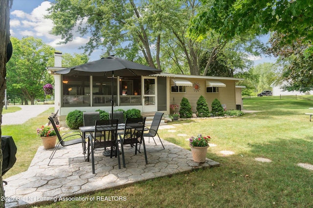 4951 Shore Ln, Perrinton, MI 48871 - view of patio / terrace with outdoor dining area and a sunroom
