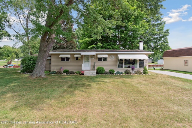 4951 Shore Ln, Perrinton, MI 48871 - ranch-style home with a chimney and a front yard