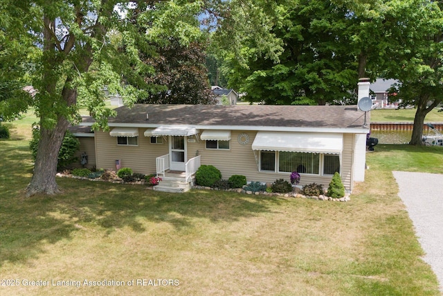 4951 Shore Ln, Perrinton, MI 48871 - view of front of property featuring a front yard and roof with shingles
