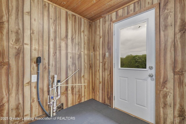 1246 House Rd N, Webberville, MI 48892 - doorway to outside with wooden walls, wooden ceiling, and carpet flooring