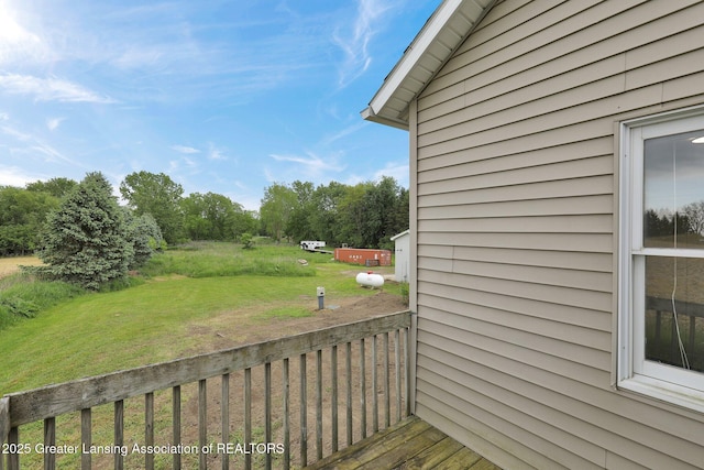 1246 House Rd N, Webberville, MI 48892 - wooden terrace with a lawn