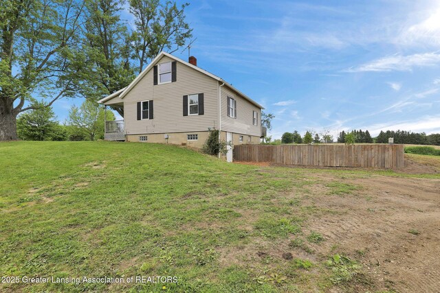 1246 House Rd N, Webberville, MI 48892 - rear view of house featuring a chimney