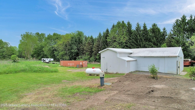 1246 House Rd N, Webberville, MI 48892 - view of green lawn with an outbuilding