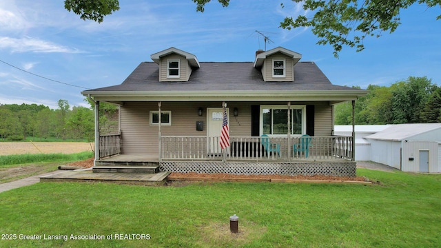 1246 House Rd N, Webberville, MI 48892 - view of front of home featuring a front yard and covered porch