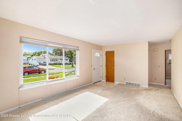 4810 Cherryland Dr, Lansing, MI 48910 - carpeted foyer featuring baseboards