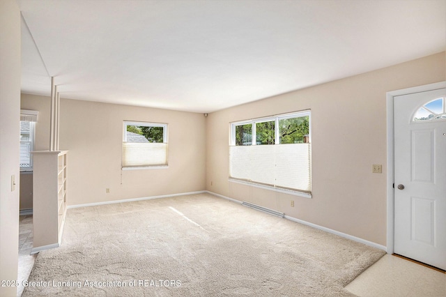 4810 Cherryland Dr, Lansing, MI 48910 - carpeted foyer entrance featuring baseboards