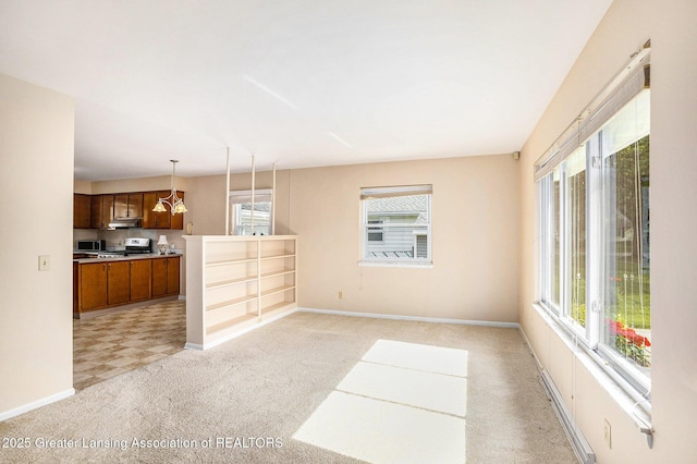 4810 Cherryland Dr, Lansing, MI 48910 - unfurnished living room featuring healthy amount of natural light, light colored carpet, and baseboards