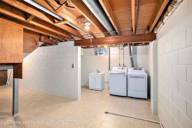 4810 Cherryland Dr, Lansing, MI 48910 - laundry area featuring washing machine and dryer and light tile patterned flooring