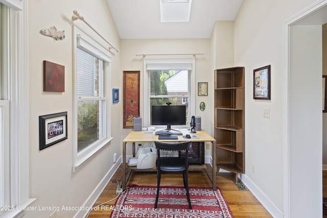 438 Bailey St, East Lansing, MI 48823 - office area with wood finished floors and baseboards