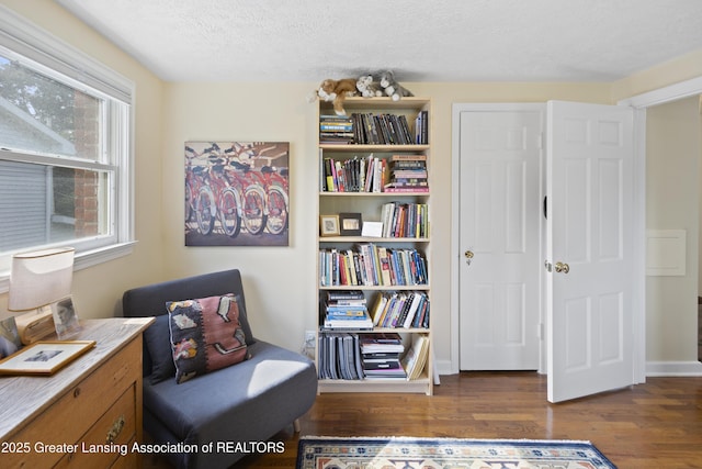 438 Bailey St, East Lansing, MI 48823 - sitting room featuring wood finished floors and a textured ceiling