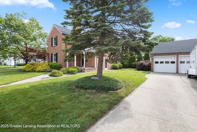 438 Bailey St, East Lansing, MI 48823 - view of front of house with a garage, a front yard, concrete driveway, and brick siding