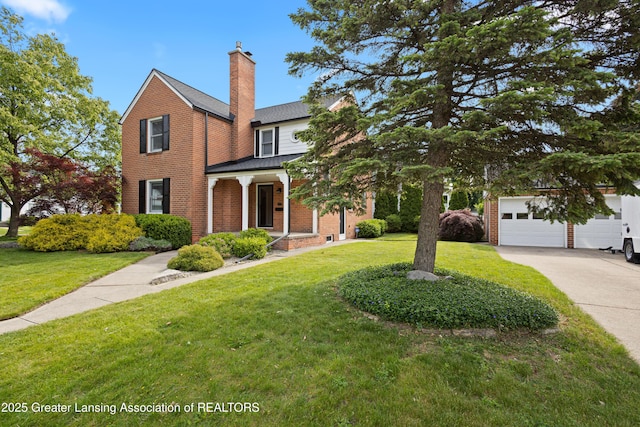 438 Bailey St, East Lansing, MI 48823 - traditional-style house featuring a garage, a front lawn, a chimney, concrete driveway, and brick siding