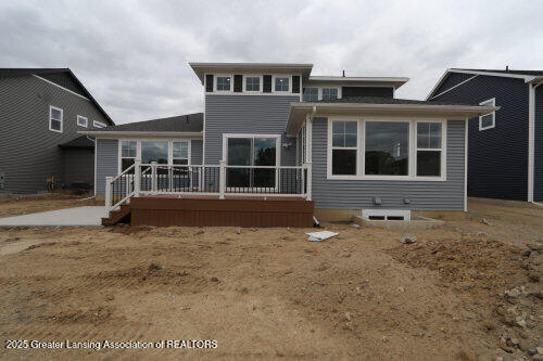 615 Magenta Ct, Haslett, MI 48840 - back of house featuring a wooden deck