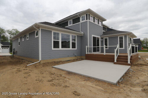 615 Magenta Ct, Haslett, MI 48840 - back of house with a patio area and a wooden deck