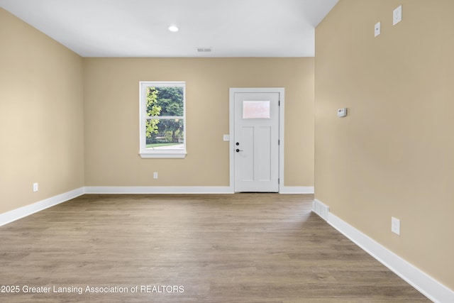 1221 W Saginaw St, Lansing, MI 48915 - entryway featuring baseboards, wood finished floors, and recessed lighting