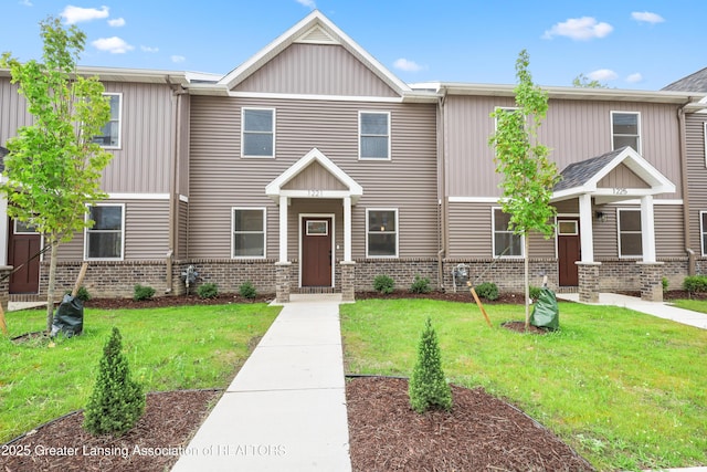 1221 W Saginaw St, Lansing, MI 48915 - view of front of house featuring a front yard and brick siding