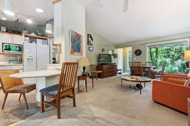 2146 Tecumseh River Rd, Lansing, MI 48906 - living area with light colored carpet and high vaulted ceiling