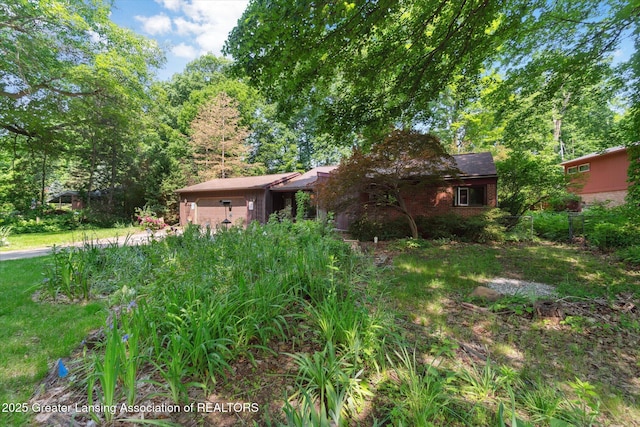 2146 Tecumseh River Rd, Lansing, MI 48906 - back of property with brick siding