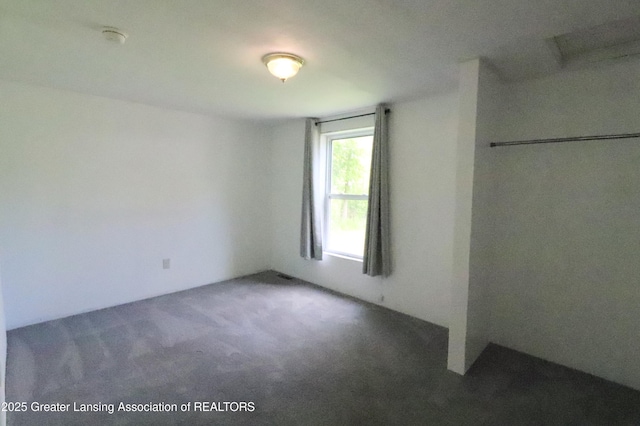 5413 S Waverly Rd, Lansing, MI 48911 - unfurnished bedroom with carpet