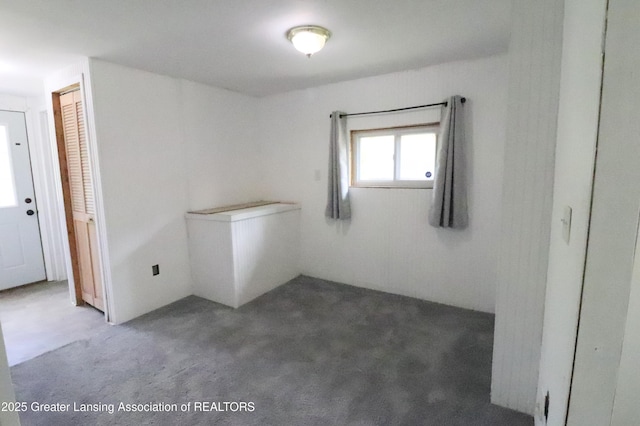 5413 S Waverly Rd, Lansing, MI 48911 - spare room featuring carpet floors