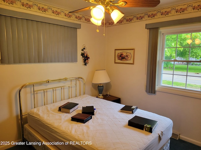 718 W Shepherd St, Charlotte, MI 48813 - bedroom featuring multiple windows and carpet floors