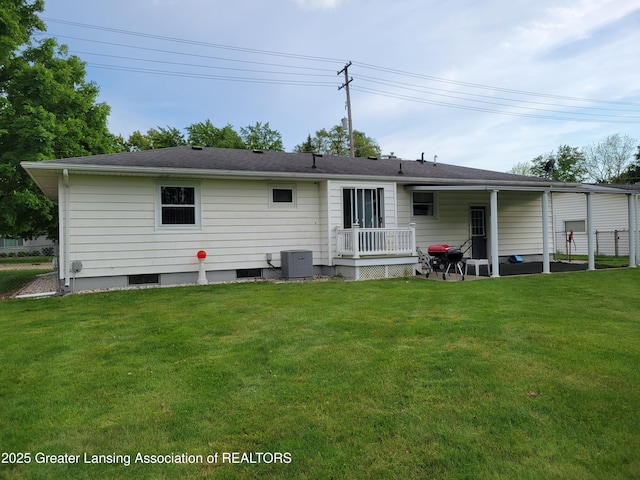 718 W Shepherd St, Charlotte, MI 48813 - rear view of house featuring central air condition unit and a patio area