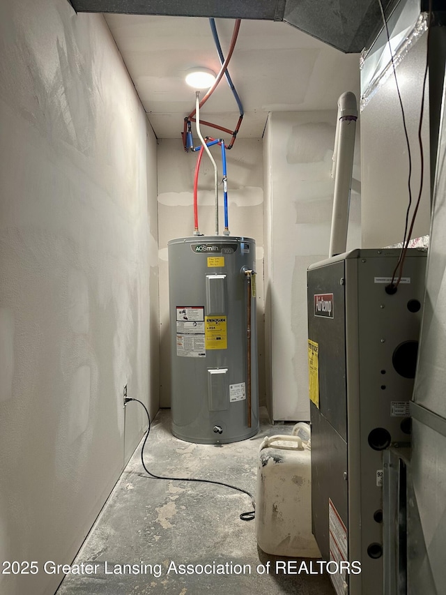 600 E Cavanaugh Rd, Lansing, MI 48910 - utility room with electric water heater and heating unit