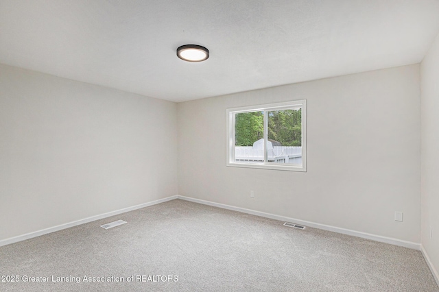 6420 Clise Rd, Bath, MI 48808 - empty room featuring carpet and baseboards